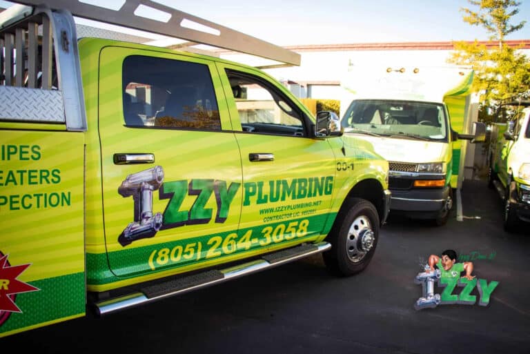 Izzy Plumbing truck with contact information displayed.
