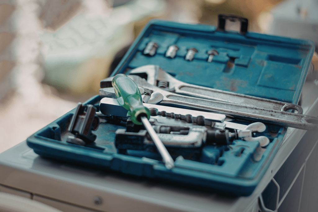 Open toolbox with wrenches and screwdriver